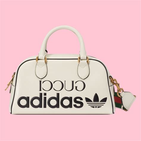 gucci adidas duffle bag white|Gucci embossed duffle bag.